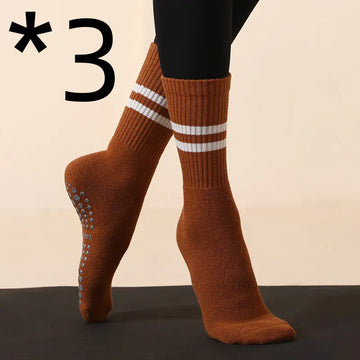 Non-slip yoga pilates fitness socks in brown with white stripes, designed for grip and comfort during workouts.