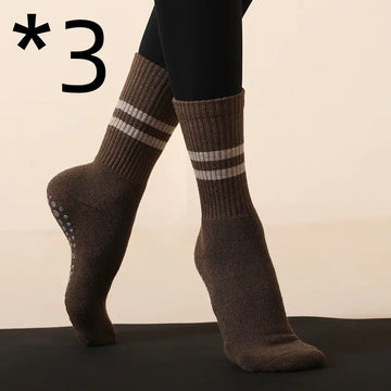 Non-slip brown Pilates yoga socks with grip dots, designed for comfort and stability during workouts.