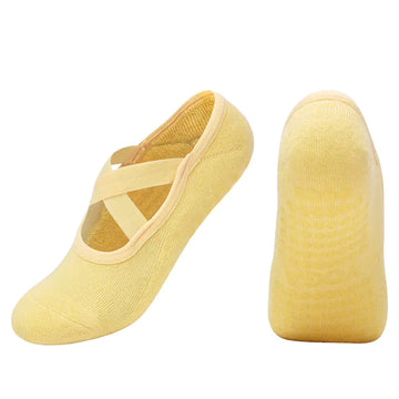 Cross strap non-slip yoga socks in yellow for dance and Pilates, offering style and stability.