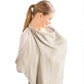 Breastfeeding in style with a chic khaki cotton maternity cape blanket for privacy and comfort.